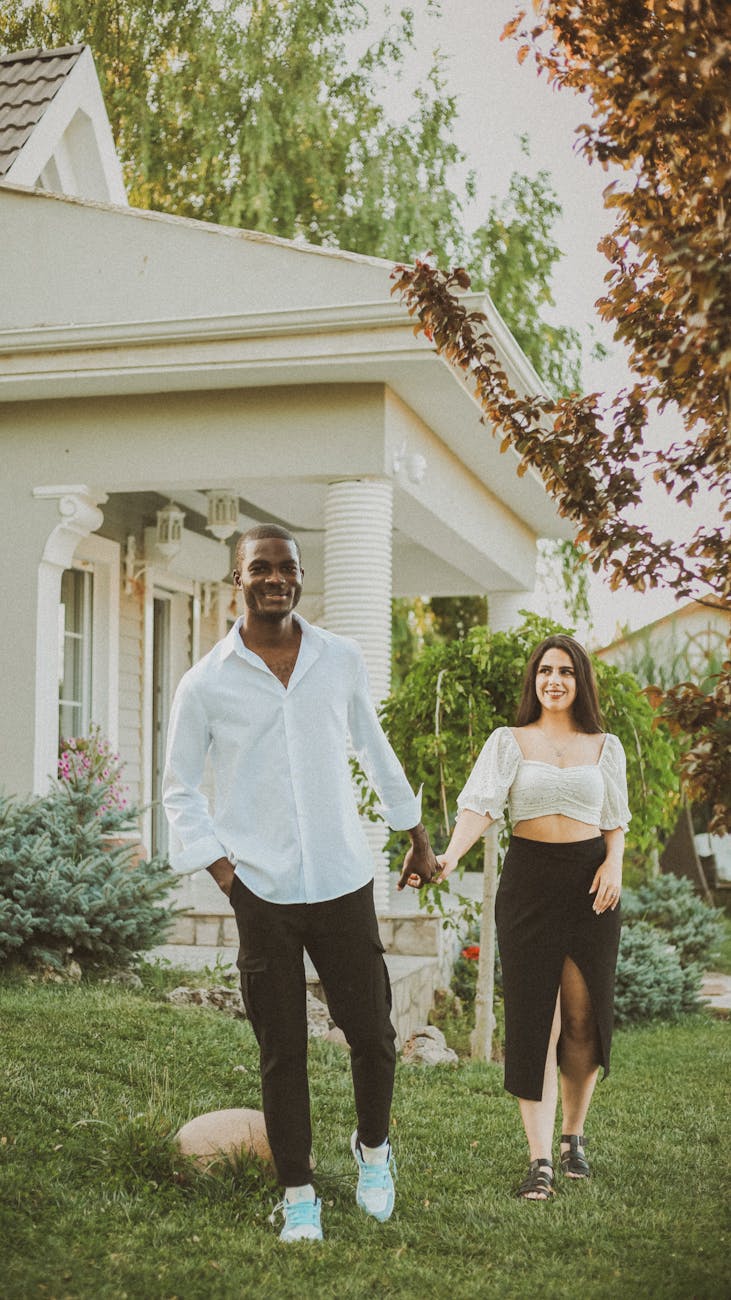 Couple walking through bright modern home